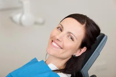 woman smiling during her dental appointment at Ember Dental Arts