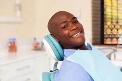 man smiling during his dental visit to Ember Dental Arts