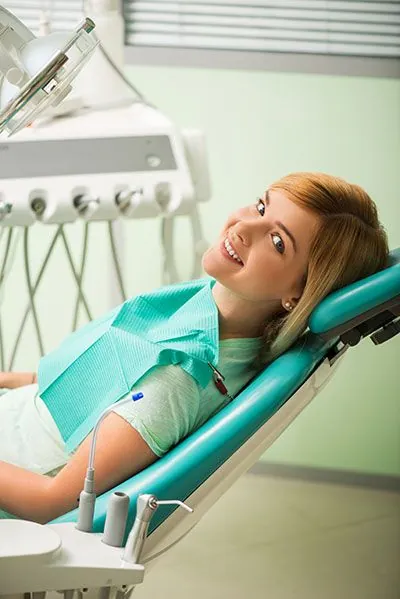 woman sitting in the dental chair at Ember Dental Arts during her smile makeover appointment